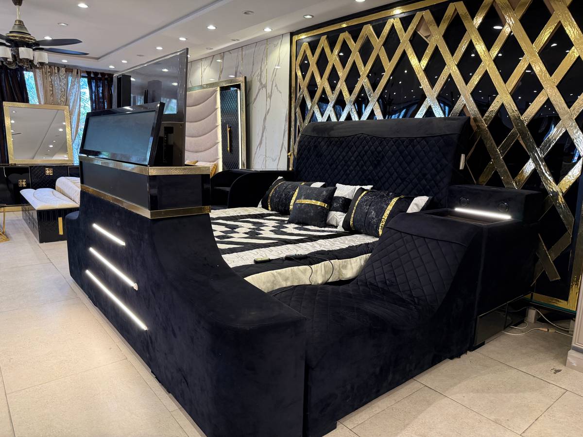 Luxurious Upholstered Bed with Integrated Entertainment System