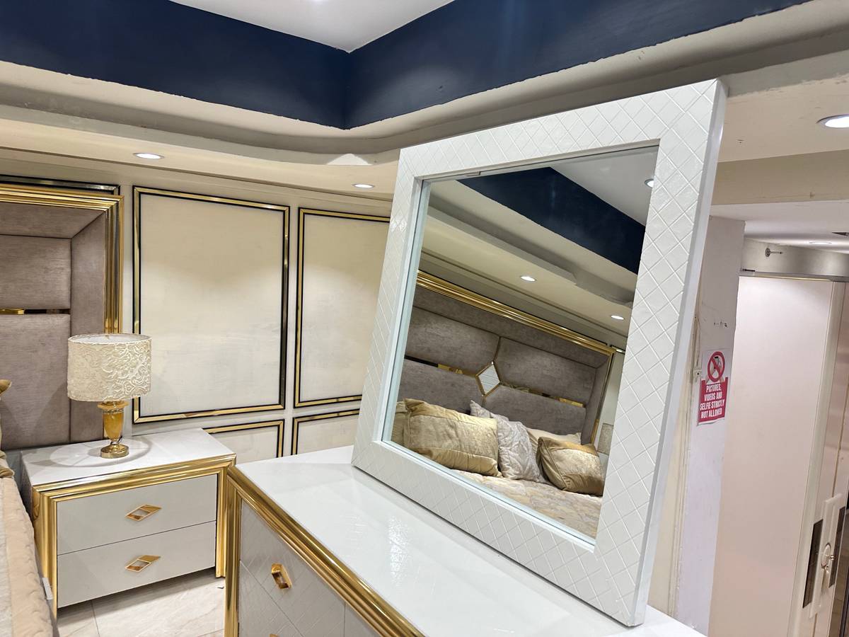 Luxury Upholstered Bed with Gold Accents and Storage Ottoman