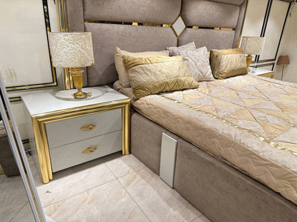 Luxury Upholstered Bed with Gold Accents and Storage Ottoman