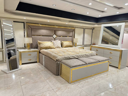Luxury Upholstered Bed with Gold Accents and Storage Ottoman