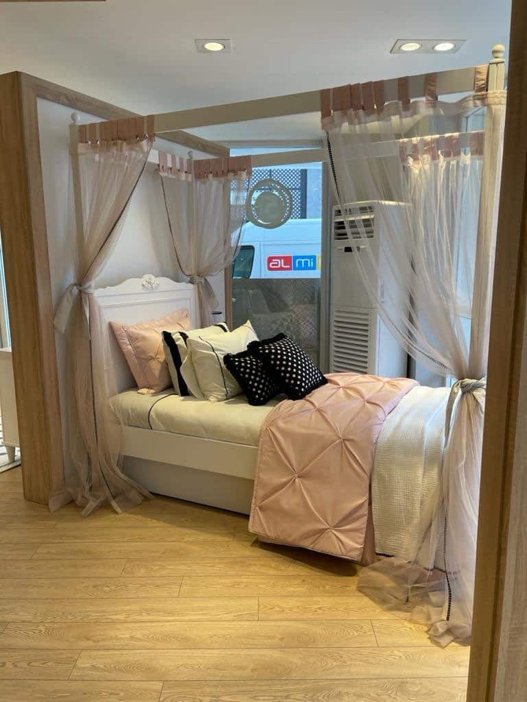 Elegant Canopy Bed with Decorative Drapes