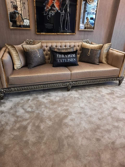 Elegant Gold Tufted Sofa with Decorative Cushions
