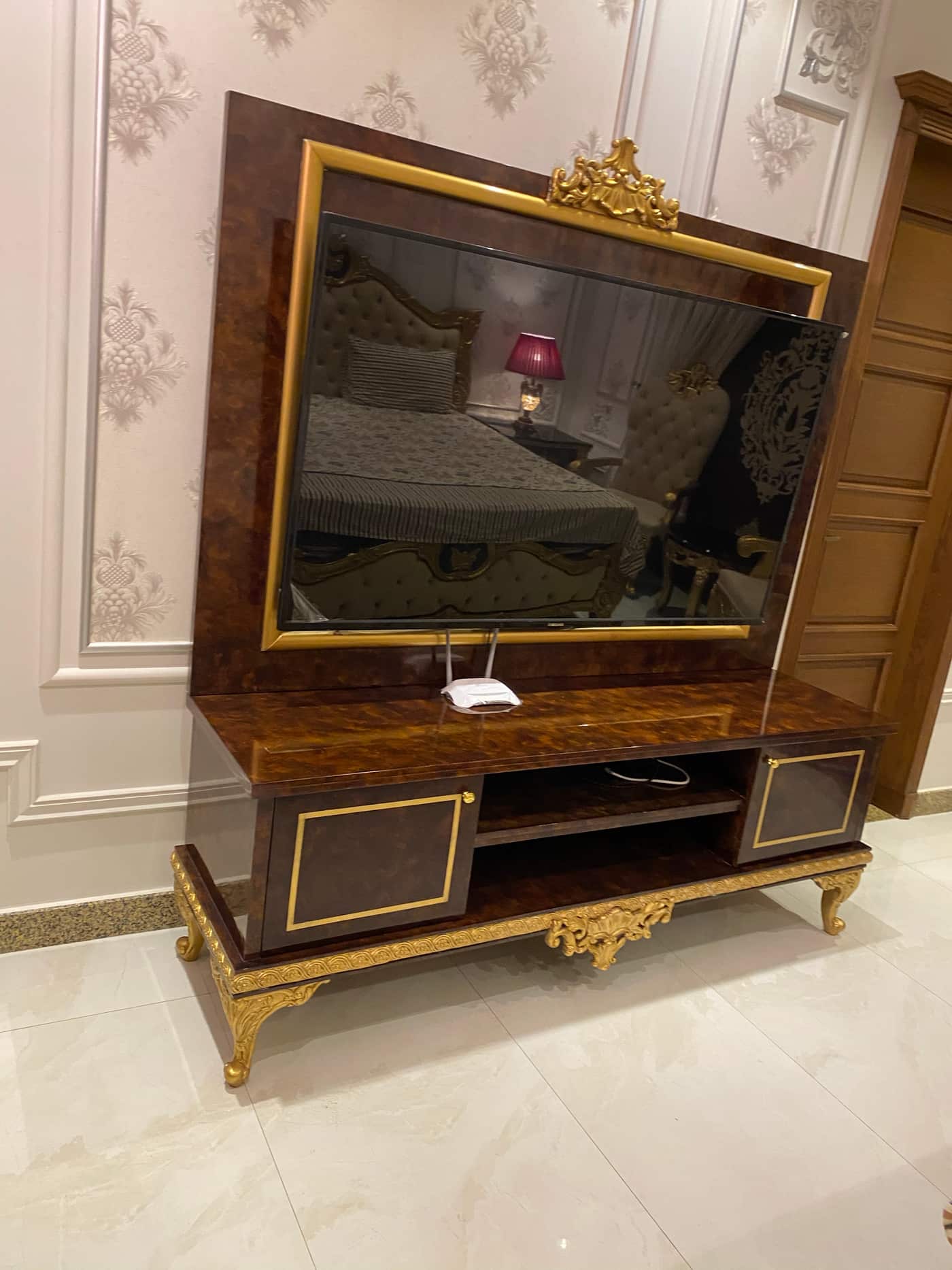 Luxurious Gold Accented TV Stand with Mirror Frame